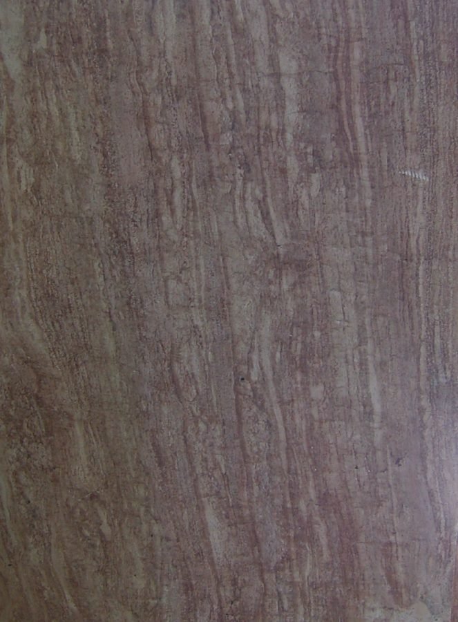 كتلة تراورتين أحمر – قطع وريدي (VC) — warm red and terracotta with directional linear stripe patterns (vein cut) — حجر طبيعي بالجملة