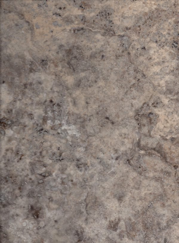 كتلة تراورتين فضي — cool silver and grey tones with characteristic travertine texture — حجر طبيعي بالجملة